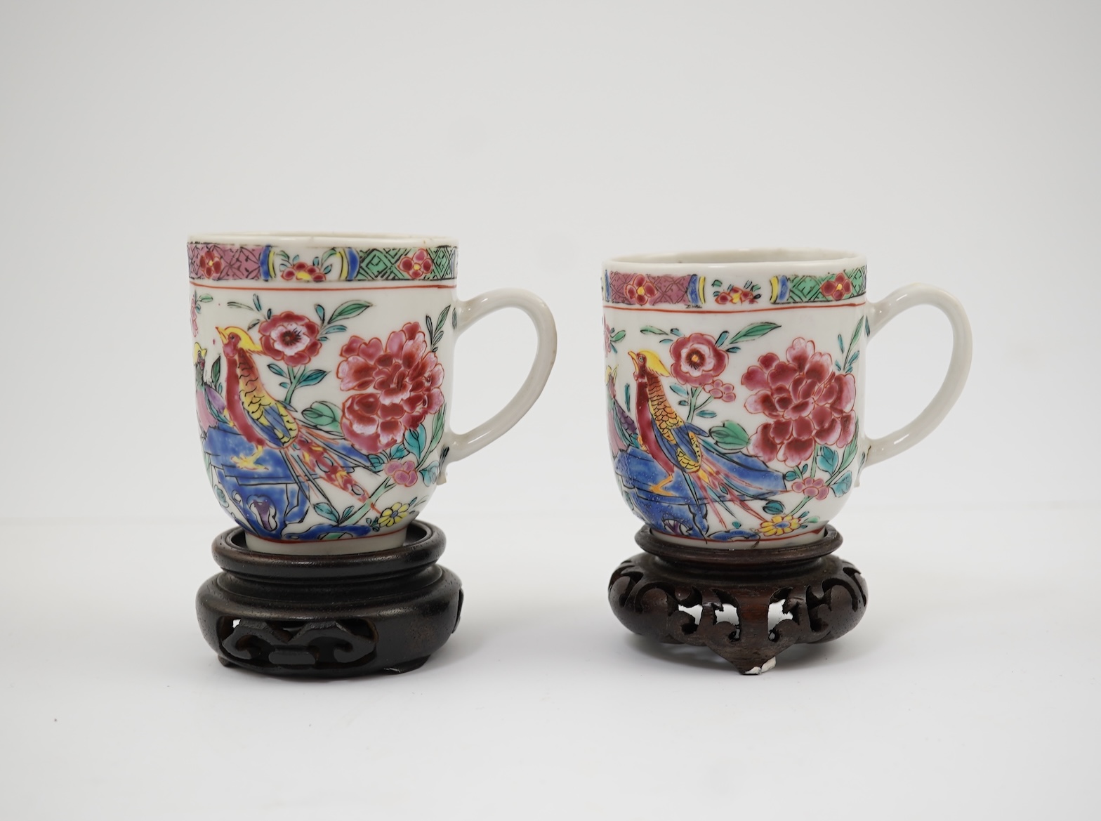 A near pair of Chinese famille rose ‘double pheasant’ coffee cups, early Qianlong period